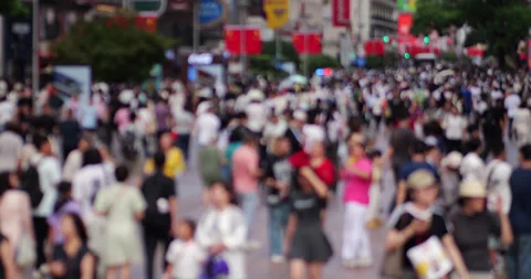 Blurry unrecognizable crowd walking on busy street of Chinese city, slow motion Stock Footage 327648023