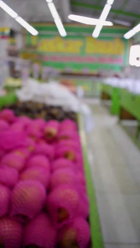 Blurry Vertical video people walking in market fruits Stock Footage 265698103