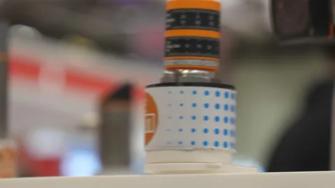 Blurry view of automated laser counting moving parts on production line Vídeo Stock 198524830