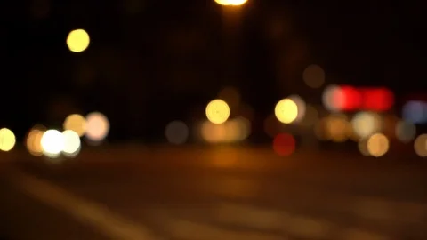 Blurry view of busy intersection in Berlin at night with tram car Stock Footage 120929667