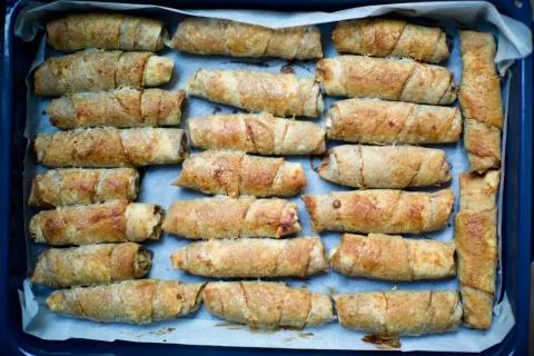 Blurry view of home made spring rolls. It contains lentils, poppy, minced meat, Stock Photos