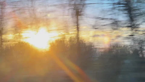 Blurry view of sunset through a moving train window Stock Footage 340237931