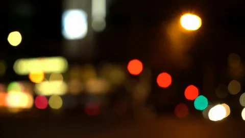 Blurry view of various types of city traffic passing by at night Stock Footage 122368006