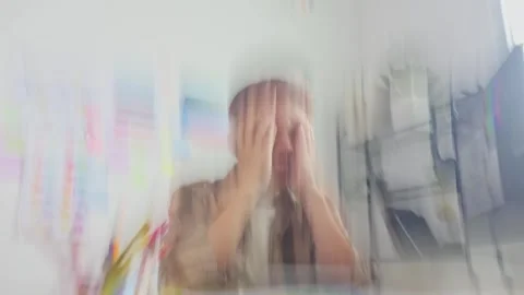 Blurry zoom effect of Stressed Asian designer holding head in hands at office Stock Footage 336736882
