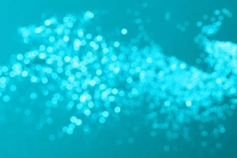 Blury glitter on blue background. Stock Photos