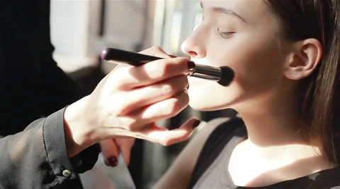 Blush application in process. Mixing-up blush colors on palette with brush Stock Footage 54636470