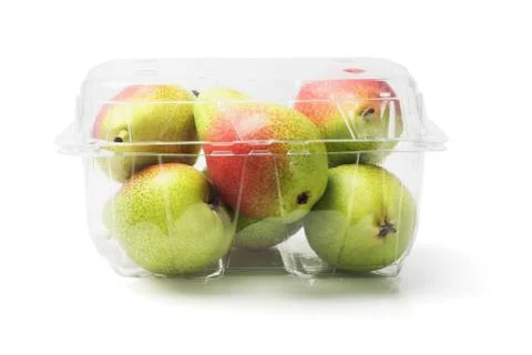 Blush pears in plastic container Stock Photos