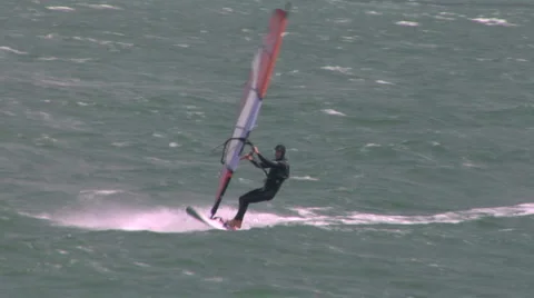 Blustery conditions for a windsurfer Video stock 1035367