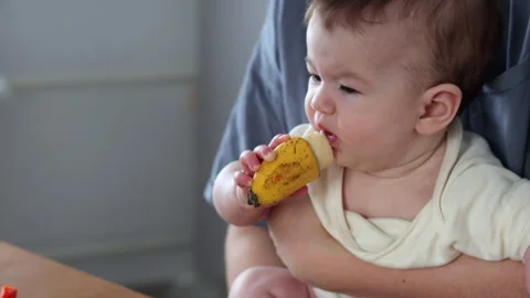 BLW. Bananas are common, high-energy foods for babies Stock Footage 329468539