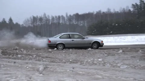 BMW E36 drifting in snow Stock Footage 167009669