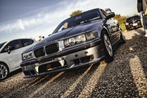 Bmw e36 tuned car at sunset car meet with vampire fangs Stock Photos