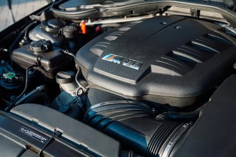 BMW engine compartment featuring M Performance V8 logo Stock Photos
