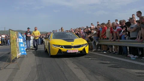 BMW i8 approaching  the starting line Stock Footage 100869207