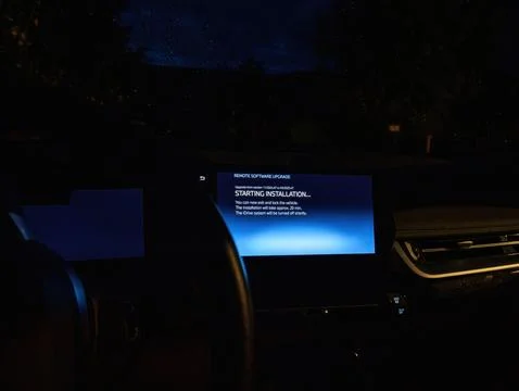 BMW iX1 remote software upgrade screen at night Stock Photos