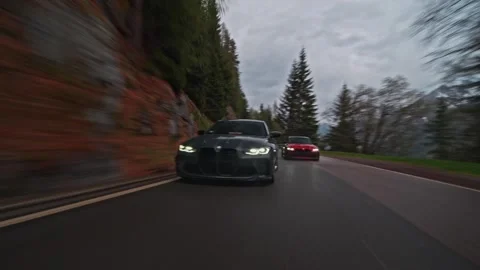 Bmw m3 competition driving fast on mountain road Stock Footage 328648382