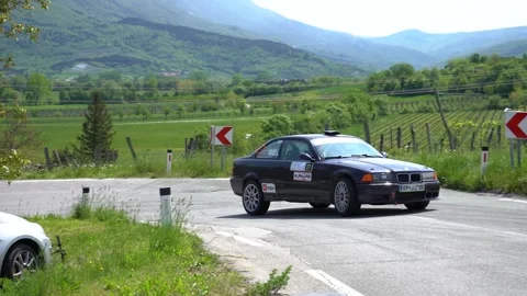 BMW M3 E36 racing on a paved mountain road Stock Footage 244739706