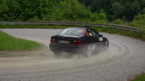 BMW M3 E36 rally car drives at high speed into a sharp corner Stock Footage 255965084