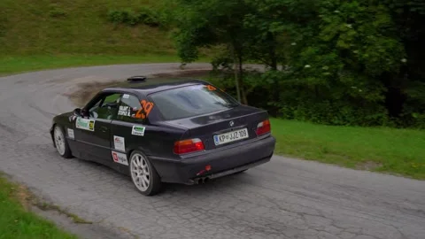 BMW M3 E36 rally car drives on a mountain paved road at high speed Stock Footage 255965131