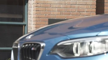 BMW Rolls into Frame Out of Focus Stock Footage 85851582
