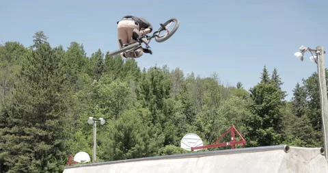 BMX 360 tabletop against forest background Stock Footage 157164849