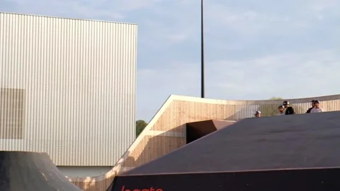 BMX athlete doing tricks on a jump in slow motion on his bicycle. Stock Footage 161101482