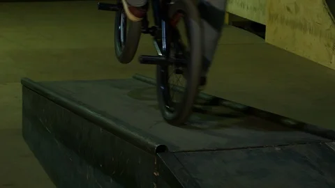 BMX Athlete Doing Tricks in underground skatebord park Stock Footage 86175927