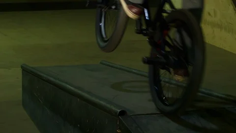 BMX Athlete Doing Tricks in underground skatebord park Stock Footage 86175948