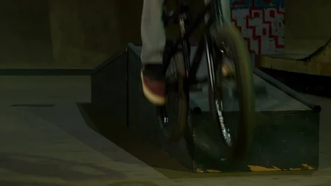 BMX Athlete Doing Tricks in underground skatebord park Stock Footage 86175968