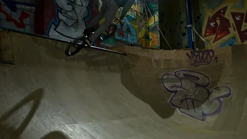 BMX Athlete Doing Tricks in underground skatebord park Stock Footage 86176072