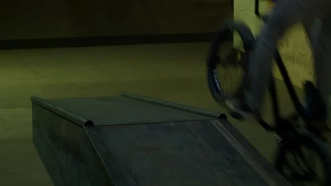 BMX Athlete Doing Tricks in underground skatebord park Stock Footage 86176420