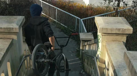 A bmx athlete going down stairs Stock Footage 57349070