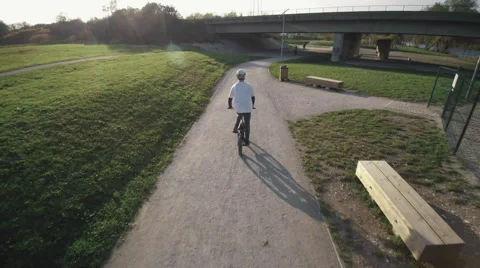 A bmx athlete riding on a path Video stock 57345859