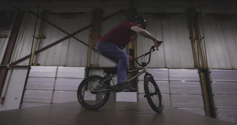 BMX bar spin trick on jump ramp Stock Footage 211883339