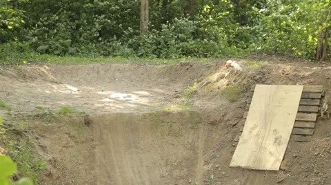Bmx biker riding in forest Stock Footage 65304838