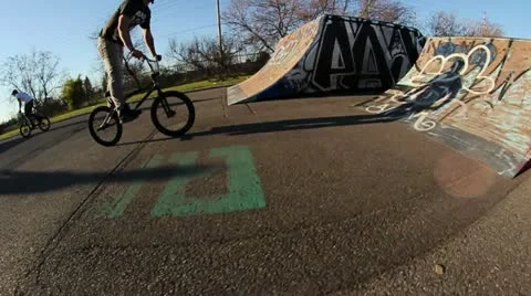 Bmx does multiple skatepark tricks Stock Footage 20572012