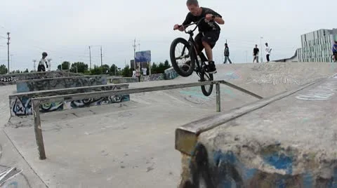 Bmx falls backwards onto concrete Stock Footage 8960227