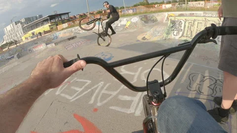 BMX POV trick in background Stock-Footage 211889672