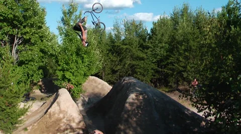 Bmx rider backflip fail with unique bailout in slow motion Stock Footage 27694552