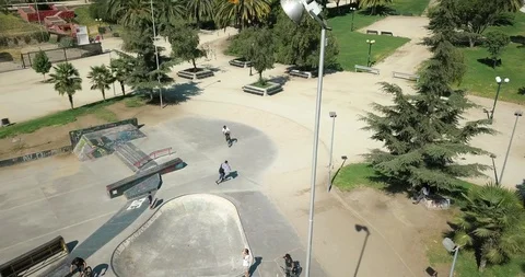 BMX RIDER BIKER DOING TRICKS  IN SKATE PARK AERIAL TURNAROUND SHOT 4K Stock Footage 102379350