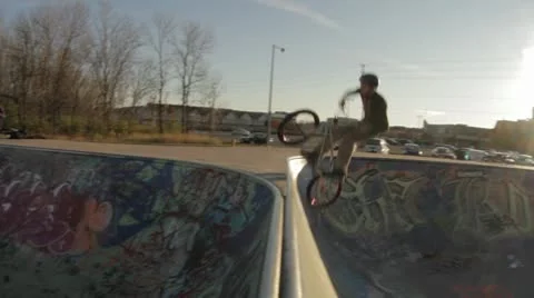 BMX rider does a barspin stall. Stock Footage 8953202