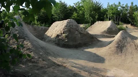Bmx rider does a big tailwhip on a dirt jump Video stock 8960202