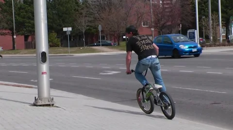 Bmx rider does cool tricks in the street Stock Footage 51703875