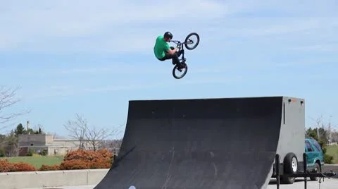 Bmx rider does a huge 360 tailwhip Stock Footage 8959320