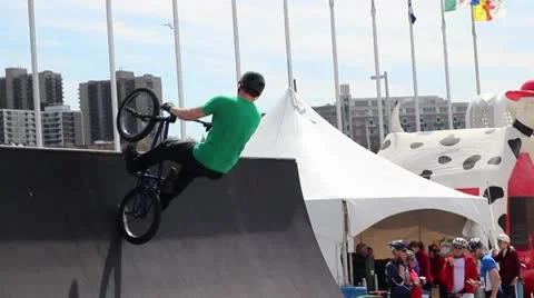 Bmx rider does a huge 360 tailwhip (different angle) Stock Footage 8959326