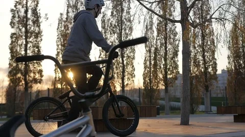 The bmx rider does the trick. at sunset in slow motion Stock Footage 82602990