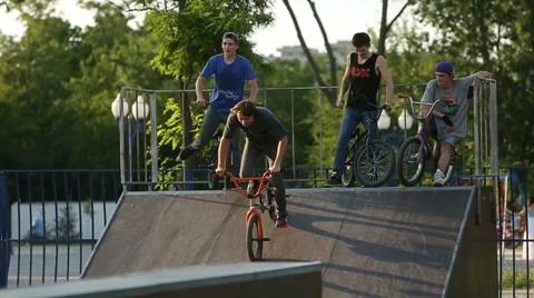 BMX rider does various tricks while riding in skatepark Stock Footage 65140163