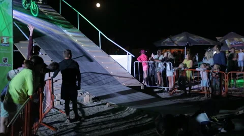 Bmx Rider making a Bike Trick During The Dirt Jumping championship at night Stock Footage 59431719