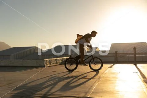 BMX rider on a rooftop Stock Photos