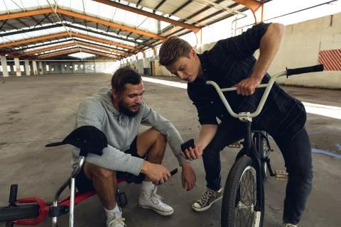 BMX riders in an empty warehouse Stockfoto's