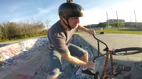 Bmx slow motion head mount tailwhip jump Stock Footage 55354945